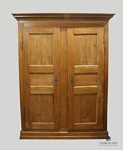 null Cabinet in natural wood molded, it opens with two doors in front revealing four...