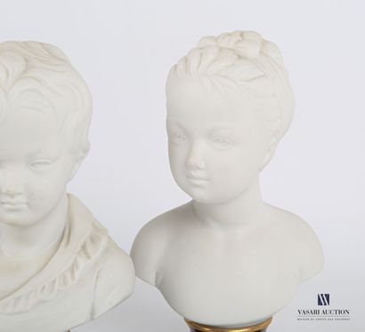 null Pair of bisque busts representing two heads of children, they rest on pedestal...