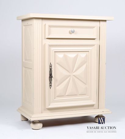 null Jam cupboard in natural wood molded and painted beige, it opens in front of...