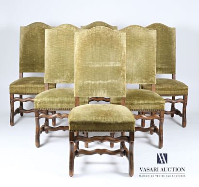 null Suite of six chairs with straight back, they rest on a base with sheepskin bone...