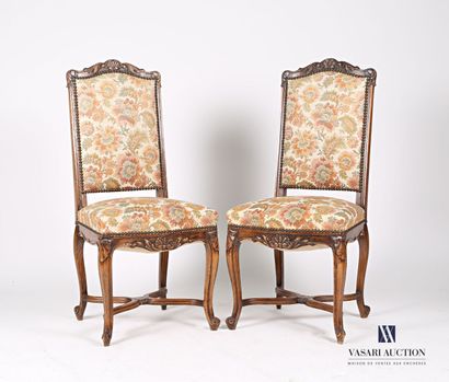 null Suite of two chairs in molded natural wood, the back decorated with a shell...
