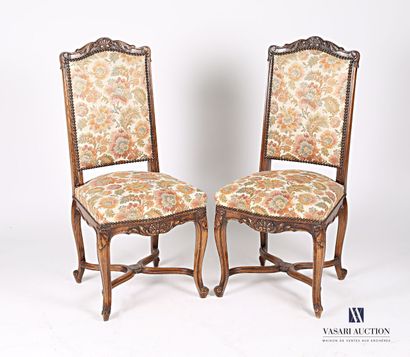 null Suite of two chairs in molded natural wood, the back decorated with a shell...