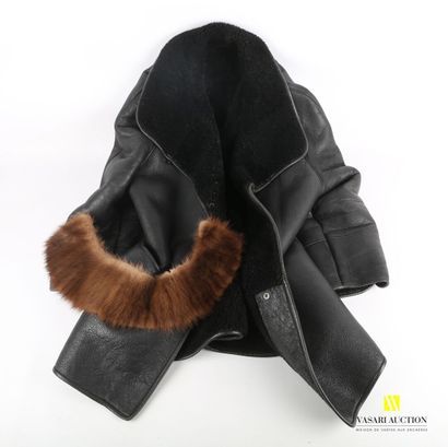 null Lot including a black dyed leather coat, lined with wool, bearing the label...