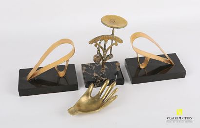 null Lot including a pair of free-form gilt metal bookends on a black marble base...