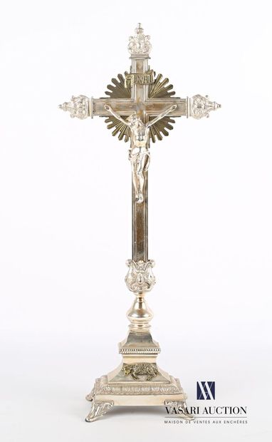 null Silver-plated metal cross standing on a rectangular base finished by four leafy...