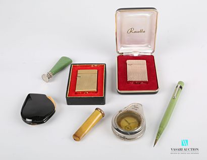 null Lot including a tinted horn cigar holder with a blind cartridge, the silver...