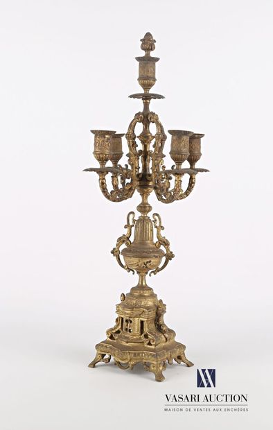 null Bronze candelabra with five arms of light, the shaft presents an urn flanked...