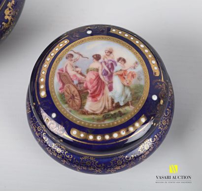 null Lot including two porcelain candy boxes treated in polychromy and gilded enhancement...