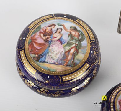 null Lot including two porcelain candy boxes treated in polychromy and gilded enhancement...