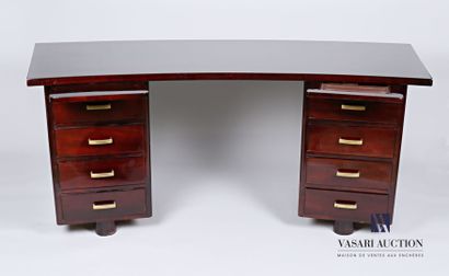 null Varnished mahogany veneer middle desk, the curved top rests on two boxes with...