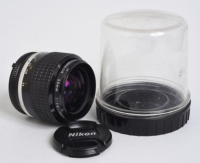 null Nikon (silver) Nikkor Ai 35mm f/1.4 lens with its plexiglas protection box and...