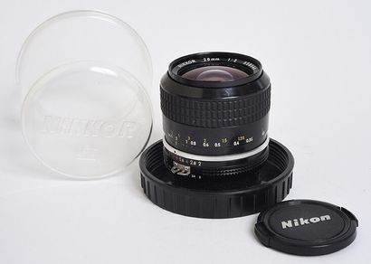 null Nikon (silver) Nikkor Ai 28mm f/2 lens with its plexiglass protection box and...