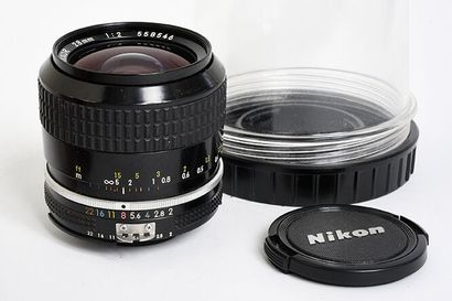 null Nikon (silver) Nikkor Ai 28mm f/2 lens with its plexiglass protection box and...