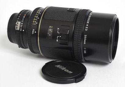 null Nikon Tele AF Nikkor ED 200mm f/3.5 lens and 2 caps

Average condition, mold...