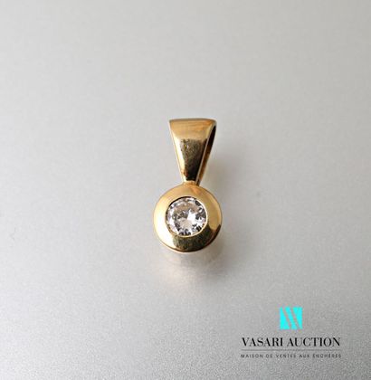 null Round yellow gold pendant set with a close-set diamond weighing approximately...