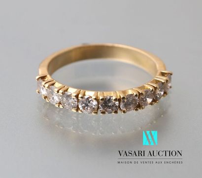 null Half ring in yellow gold 750 thousandth set with nine diamonds of about 0.10...