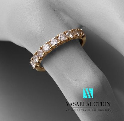null Half ring in yellow gold 750 thousandth set with nine diamonds of about 0.10...