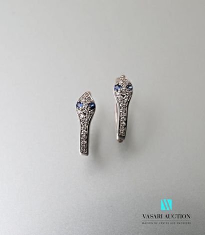 null Pair of earrings in white gold simulating a snake adorned with four sapphires...