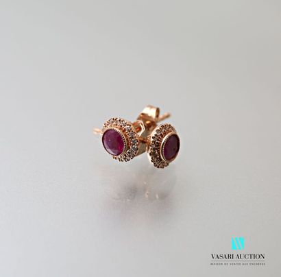 null Pair of ear studs in pink gold 750 thousandths decorated with two round rubies...