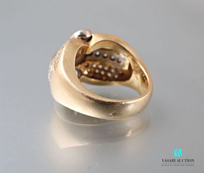 null Dome ring in gold 750 thousandths of two tones paved with diamonds. The central...