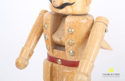 null Nutcracker in carved wood representing a soldier with a moustache, the eyes...