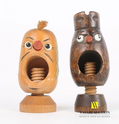 null Lot including two carved and partly painted wood nutcrackers representing a...