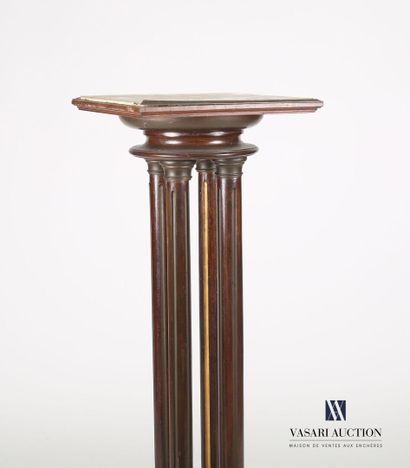 null Veneer and stained wood sellette standing on a square base supporting a round-shaped...