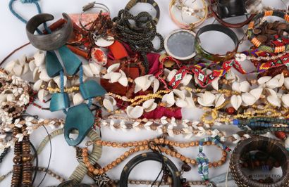 null Lot of costume jewelry including shell necklaces, wooden bracelets, horn and...