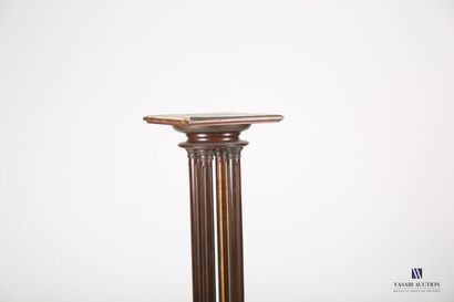 null Veneer and stained wood sellette standing on a square base supporting a round-shaped...