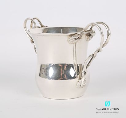 null Silver cup on a flat bottom, the flared body has two handles simulating intertwined...