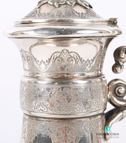 null A baluster-shaped silver coffee pot standing on a pedestal base, the body presents...