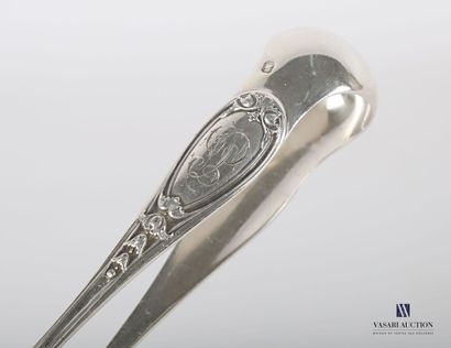 null Silver sugar tongs, the arms decorated with medallions surmounted by leafy clasps...