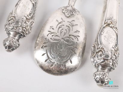null Condiment set of four pieces in silver, the handles filled with scrolls, interlacing...