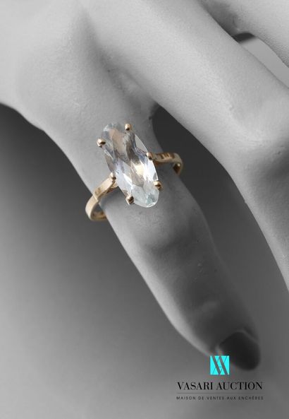 null Yellow gold ring 750 thousandth set with an oval aquamarine, eagle head hallmark...