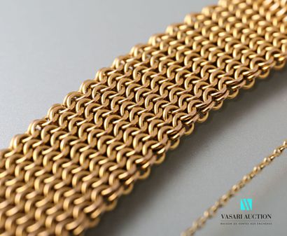 null Bracelet ribbon in yellow gold 585 thousandths interlaced round mesh, clasp...