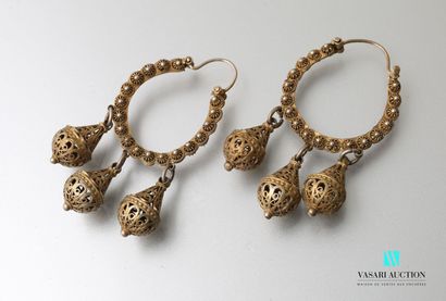 null A pair of gilded metal earrings in the form of creoles decorated with small...