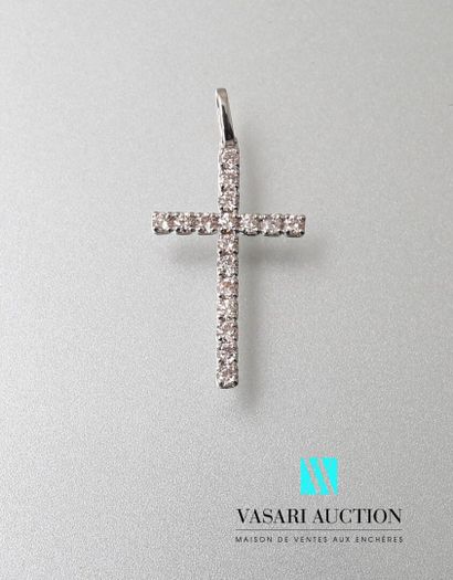 null White gold cross pendant, the arms adorned with round diamonds calibrating a...