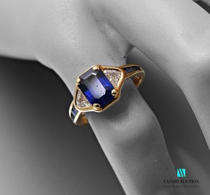 null Mauboussin, yellow gold ring set with a rectangular sapphire with cut sides,...