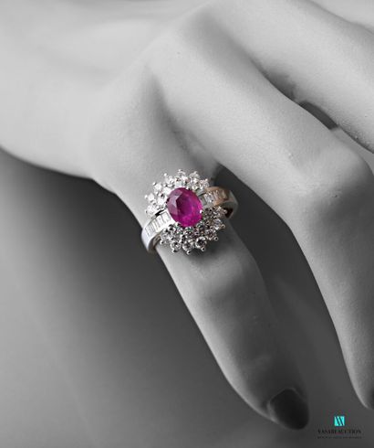 null White gold oval ring set with an oval Burmese pink sapphire weighing 1.51 carats...