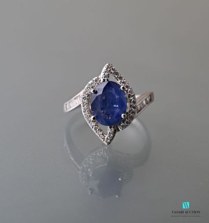 null Design ring in white gold 750 thousandth set in its center with an oval sapphire...