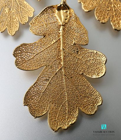 null Half set of gold plated oak leaves including: a brooch pendant and a pair of...