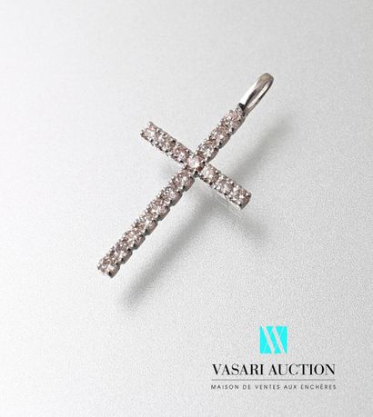 null White gold cross pendant, the arms adorned with round diamonds calibrating a...
