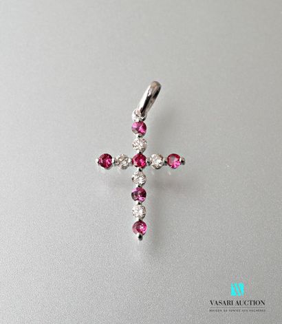 null Cross in white gold 750 thousandth, the arms decorated with six round rubies...