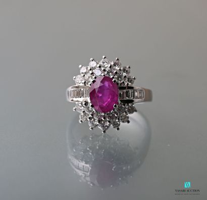 null White gold oval ring set with an oval Burmese pink sapphire weighing 1.51 carats...