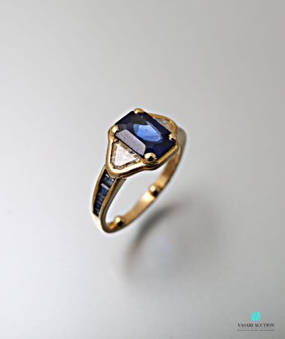 null Mauboussin, yellow gold ring set with a rectangular sapphire with cut sides,...
