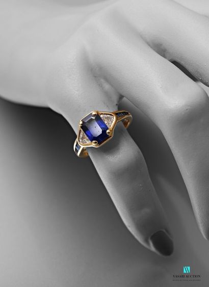 null Mauboussin, yellow gold ring set with a rectangular sapphire with cut sides,...