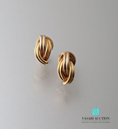 null Pair of earrings in yellow gold 750 thousandths three interlaced godronné motifs...