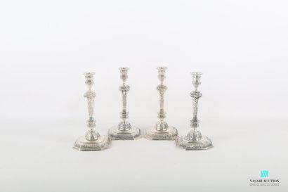 null Suite of four silver torches standing on an octagonal base hemmed with foliage...
