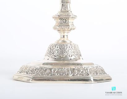 null Suite of four silver torches standing on an octagonal base hemmed with foliage...