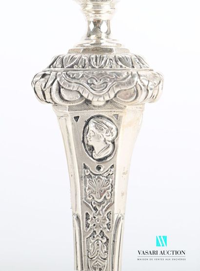 null Suite of four silver torches standing on an octagonal base hemmed with foliage...